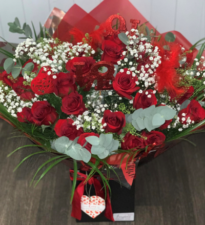 Forever and Always - Show them they are your Forever and Always, with 24 stunning red roses! This aqua hand tied bouquet is the perfect show-stopping gift this Valentine's Day.