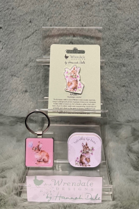 Wrendale Rabbit Accessories - These accessories will be the perfect addition to your keys or outfit! 
They make a great treat for yourself or someone special. 
The wonderful rabbit pin badge will add an extra flourish to your jacket, scarf and bag or pin board. 
Never lose your keys again with a simple yet adorable metal keyring
 
Keep your lips moisturised and nourished with this delicate lip balm in illustrated tin. The hydrating lip balm has a sweet scent of honey and vanilla. 
*PLEASE SPECIFIED ITEM IN ORDER DESCRIPTION *
*ITEM IS ONLY AVAILABLE AS AN ADD ON GIFT OR FOR COLLECTION*
*LIMITED AVAILABILITY*
Pin badge details- Badge 35mm, backing card 105mmx75mm.  Each pin badge comes on information card with a to/from section on the back. Made from alloy with a silver finish. Nickle free and card made from sustainable sourced board. 
Metal keyring details- 4cmx8cm including the ring. Cast in hard wearing zinc alloy metal with a resin domed finish on the front.
Lip balm details - Measures 45mm x 45mm x 15mm.Made in the UK. 100% cruelty free. Enriched with shea butter. Paraben & SLS free.