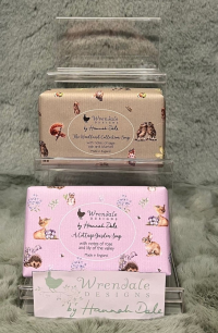 Wrendale Wrapped Soaps - These gorgeous scented soap bars make a delightful gift. The beautifully wrapped soaps are available in two wonderful fragrances: 
'Woodland' - with notes of sage, oak and bluebell. 
'Cottage Garden' - with notes of rose and lily of the valley.
*PLEASE SPECIFIY PREFERED FRAGRANCE IN ORDER DESCRIPTION *
*ITEM IS ONLY AVAILABLE AS AN ADD ON GIFT OR FOR COLLECTION*
*LIMITED AVAILABILITY*
Measures 105mmx57mmx35mm, 190g bar. Paraben & SLS free, vegan friendly, made in the UK.