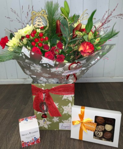Christmas Star Luxury Gift - Spoil that someone special this Christmas with an impressive hand tied bouquet in festive colours, a box of luxury Belgian chocolates, a Prices scented candle and a sparkling crystal light catcher. A treat for all your senses.

Bouquet arranged in a fully lined box. Tree or Wreath ligt catchers available.

**AT THIS LATE DATE FLORISTS CHOICE WILL APPLY TO ALL ORDERS** NO RED LEFT

*PLEASE NOTE FLOWERS & PACKAGING MAY VARY, DUE TO AVAILABILITY*
